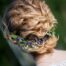 The bride is preparing for the wedding. Beautiful hairstyle with a hoop. Back of the head.