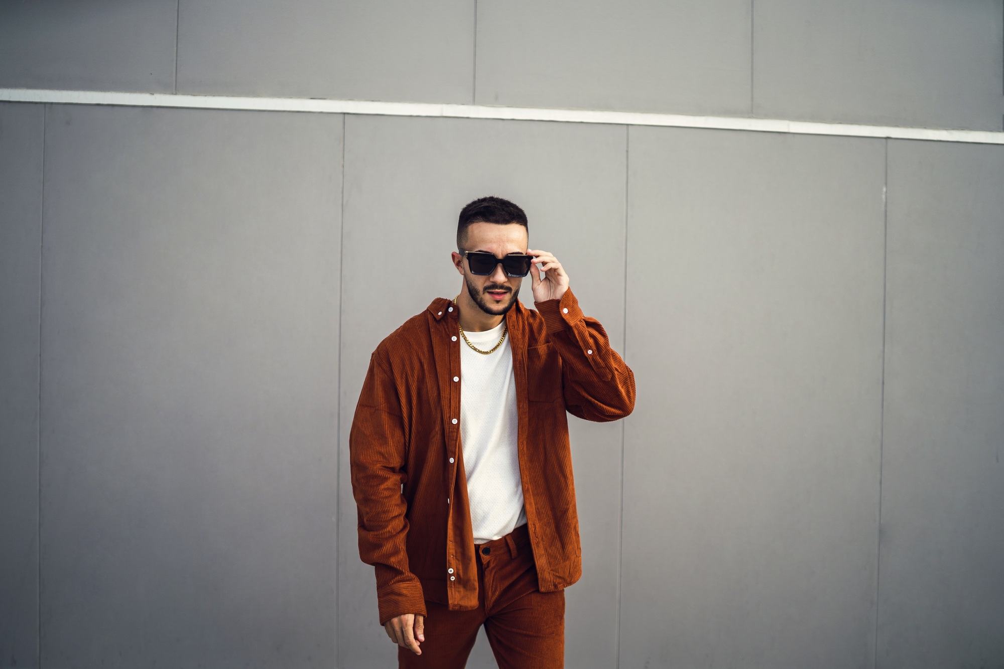 European young man posing in a streetwear