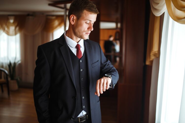 Luxury groom in suit. Businessman. Morning Groom Fees. beginning of the wedding day. Men's fashion.